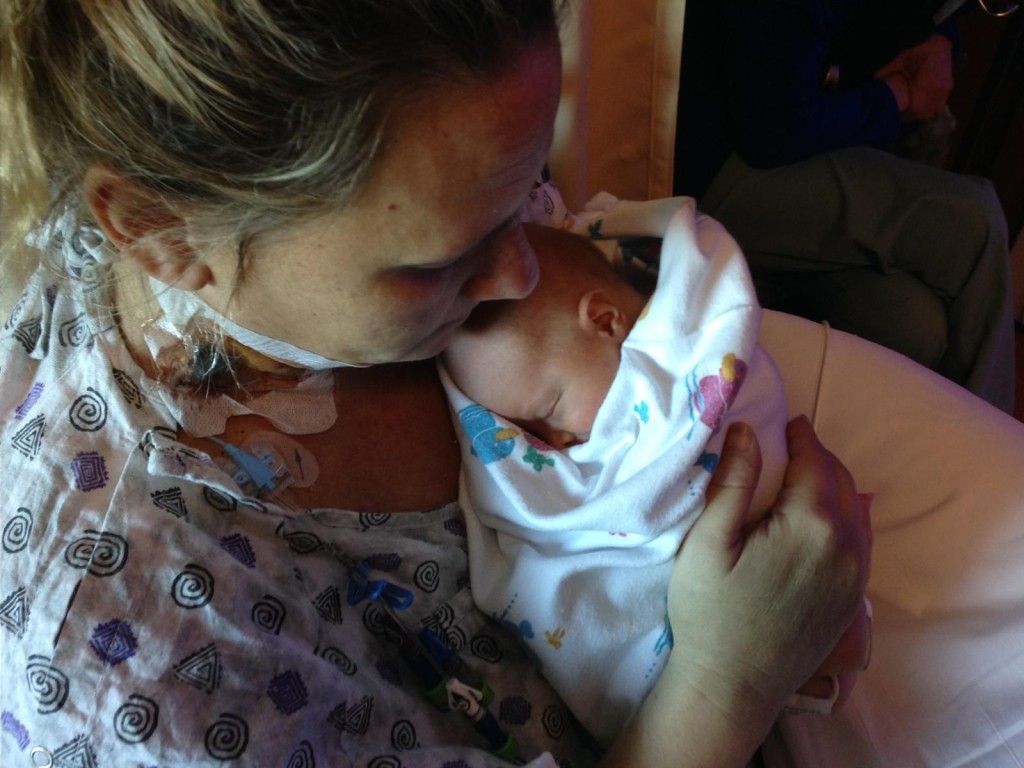 AFE Survivor, Lisa Deiter, holding her baby.