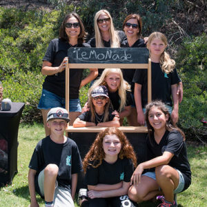 Women and their children with their lemonade stand fundraising event.